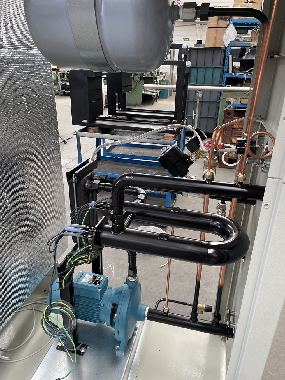 Image showing components of a Tempco TREG thermoregulation unit, for which scheduled maintenance is essential for the operational continuity of pumps, motors, and other components.