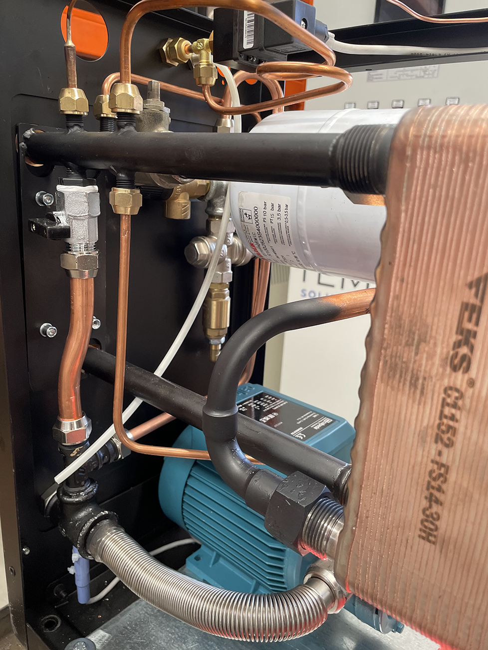 Image showing components of a thermoregulation unit, with a heat exchanger in the foreground, for which a maintenance program is the smartest choice.