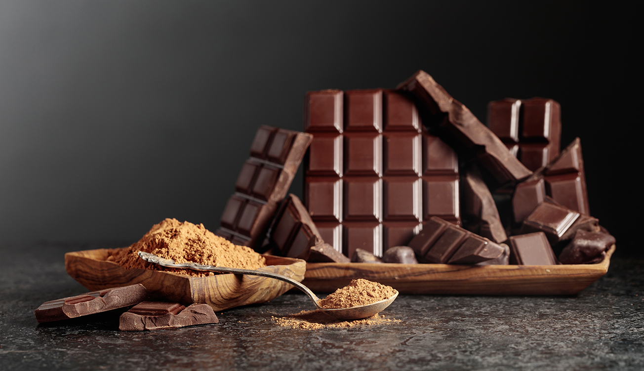 Image illustrating the final shaping and cooling stages with temperature control units in chocolate production.