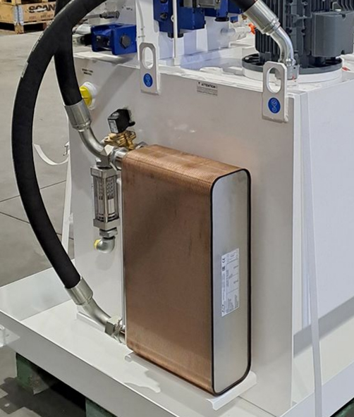 Image showing a brazed plate heat exchanger for hydraulic oil cooling installed on a hydraulic power unit.